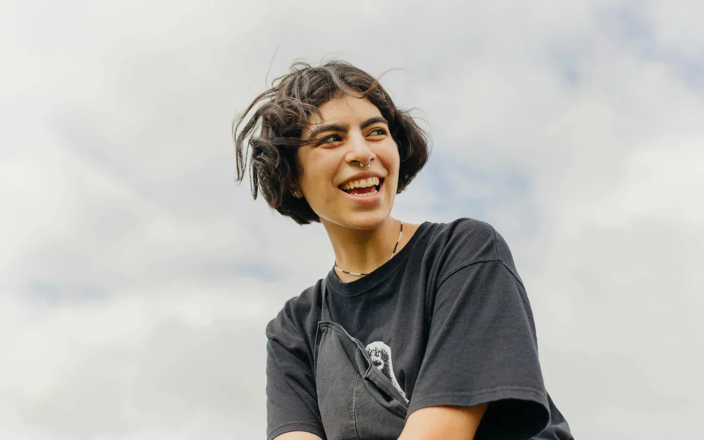 Happy person with sky in background. Image credit: Frank Flores