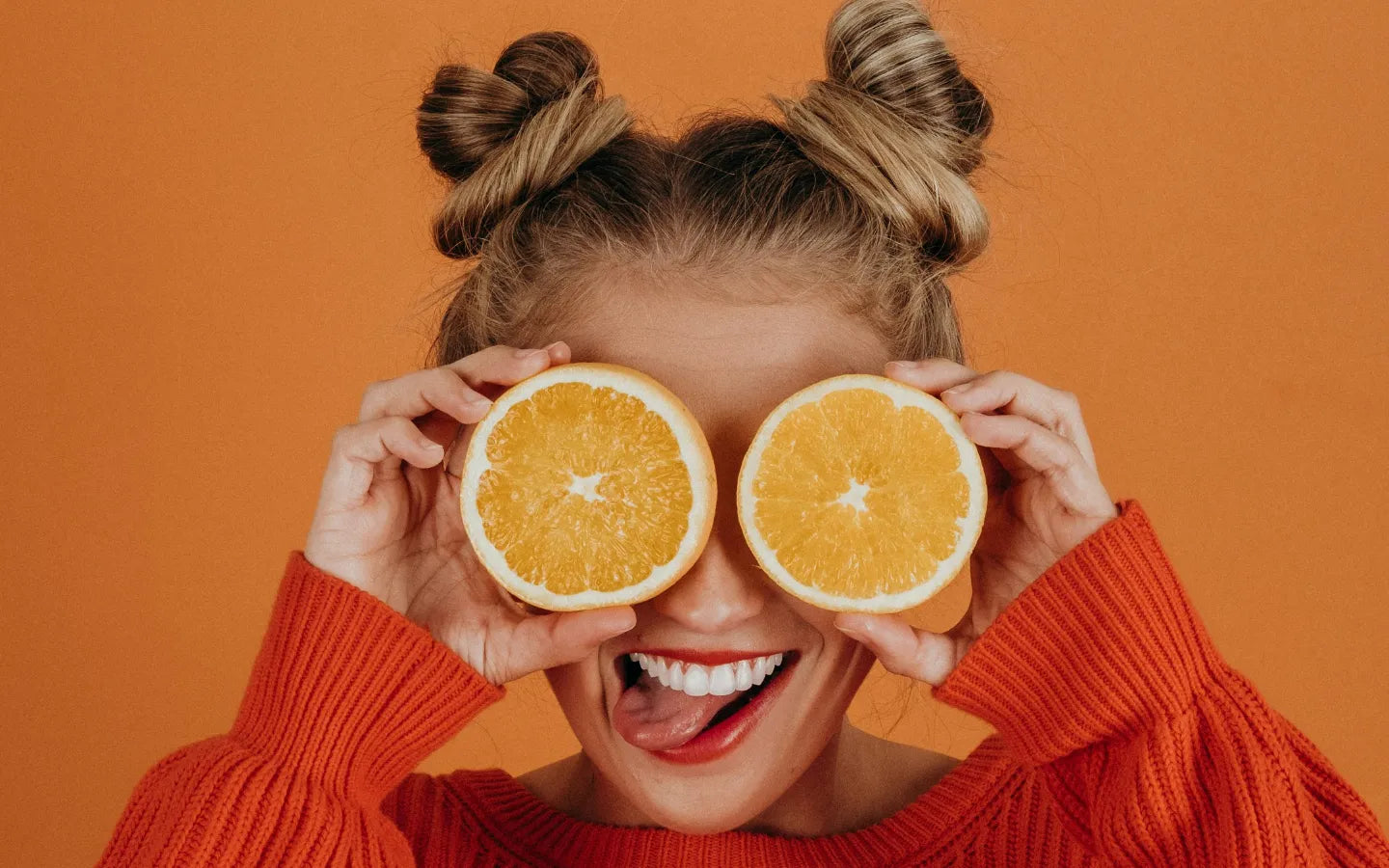 Oranges as eyes on orange background. Image credit: Noah Buscher